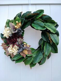 a wreath made out of leaves and flowers