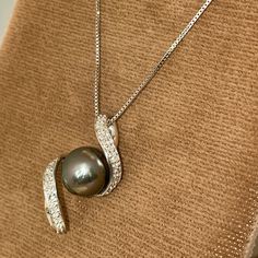 Final Price. No Trades. Nwt Brand New With Tags. Solid, Stamped 14k White Gold Pendant And Neck Chain. Necklace Is Approximately 18” In Length. Box Link Chain Is Secured With A Lobster Claw Style Clasp. Modern Swirl Design Pendant Features A Tahitian Pearl With Natural, Round Cut Diamonds. Approximately 1/8dwt. Purchased Many Years Ago, Prices Have Significantly Increased Since Then. An Amazing Gift. Pearl Diamond Necklace, Pearl And Diamond Necklace, White Gold Pendant, Neck Chain, Tahitian Pearls, Swirl Design, Pearl Diamond, Round Cut Diamond, Link Chain