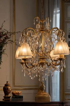 a chandelier hanging from the ceiling in a room