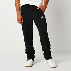 These adidas men's sweatpants were made for your comfort during workouts or lounging at home. Made from soft cotton-fleece with the brand's signature stripes and logo, these pants have an elastic-drawstring waist, side slip pockets, and a straight-leg silhouette. Style them with a t-shirt and hoodie. Front Style: Flat FrontFeatures: DrawstringClosure Type: Full Elastic, DrawstringFit: Regular FitPockets: 2 Side Slip PocketsRise: At WaistFiber Content: 78% Cotton, 22% PolyesterFabric Description: Adidas Sportswear Sweatpants For Gym, Adidas Athleisure Sweatpants For Gym, Sporty Adidas Sweatpants With Elastic Waistband, Sporty Adidas Moisture-wicking Sweatpants, Adidas Sporty Sweatpants With Moisture-wicking, Adidas Moisture-wicking Sweatpants For Jogging, Adidas Sporty Moisture-wicking Sweatpants, Adidas Sweatpants With Elastic Waistband, Adidas Cotton Sweatpants For Gym