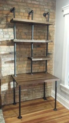 a room with a brick wall and two shelves on each side, one shelf has three metal pipes attached to it