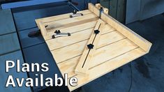 a wooden table with tools on it and the words plans available