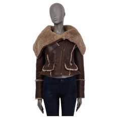 100% authentic Burberry Prorsum shearling aviator jacket in beige and brown sheepskin (100%). From the iconic fall/winter 2010 collection. Has two flap pockets and one buttoned pocket on the front. Features a wide collar and zip cuffs. Opens with a diagonal zipper on the front. Runs small and fit like an XS. Has been worn and is in excellent condition. Measurements Tag Size 40 Size XS Shoulder Width 42cm (16.4in) Bust 90cm (35.1in) to 98cm (38.2in) Waist 72cm (28.1in) to 78cm (30.4in) Hips 88cm Brown Shearling Biker Jacket With Faux Fur Trim, Designer Long Sleeve Sheepskin Leather Jacket, Brown Shearling Biker Jacket With Padded Collar, Designer Brown Shearling Outerwear, Designer Brown Outerwear With Faux Fur Lining, Designer Brown Sheepskin Outerwear, Luxury Brown Winter Biker Jacket, Luxury Brown Biker Jacket For Winter, 2010 Clothes