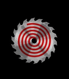 a circular saw blade with red and white stripes in the center on a black background