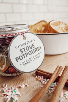 a jar filled with cinnamons next to some cookies