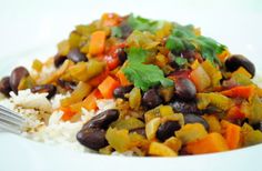 a white plate topped with rice and beans