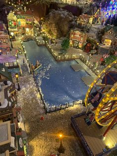 an aerial view of the amusement park at night