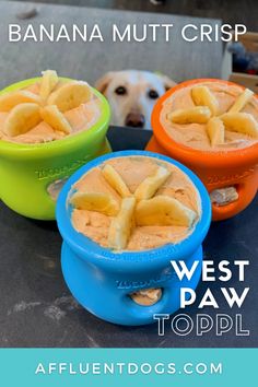 three bowls filled with bananas and peanut butter on top of a table next to a dog