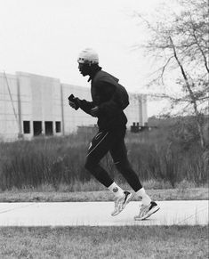 black and white photograph of a man running