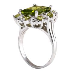 Stamped: 14K White GoldTotal Ring Weight: 6.5 GramsRing Length: N/ARing Width: N/AGemstone Weight: Total Natural Peridot Weight is 4.27 Carat (Measures: 11.06x8.87mm)Color: GreenDiamond Weight: Total Natural Diamond Weight is 0.70 CaratColor: F-G, Clarity: VS2-SI1Face Measures: 18.42x16.83 mmSku: [702688W] Luxury Multi-stone Peridot Ring, Luxury Peridot Multi-stone Rings, Antique Green Diamond Ring With Center Stone, Elegant Multi-stone Peridot Gemstones, Formal Green Birthstone Ring With Halo Setting, Fine Jewelry Peridot Gemstones For Formal Occasions, Formal Peridot Diamond Ring In Yellow Gold, Estate Style Gemstone Rings For Anniversary, Antique Green Diamond Ring For Formal Occasions