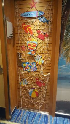 an open door with some magnets on it and a beach theme behind the door