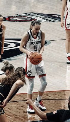 the women's basketball team is playing against each other on the court with their coach