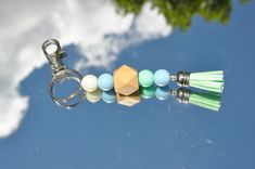 a keychain with some beads hanging from it