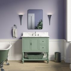 a bath room with a sink and a bath tub next to a mirror on the wall