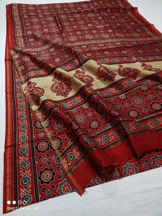 This is a beautiful pure chanderi silk saree with ajrakh  printed design  Fabric - Chanderi silk  Technique - Hand block printed. Saree length - 5.5 mtr. Blouse - 1 mtr. Running . Easy wash and care . Please note - color may be vary a little due to sunlight and photography . Please message us after purchasing in case you want fall and Pico done. No extra charges for fall and Pico but inform us . Blouse stitching is also available . Block Printed Saree, Blouse Stitching, Chanderi Saree, Ajrakh Prints, Chanderi Silk Saree, Silk Cotton Sarees, Printed Saree, Indian Saree, Design Fabric