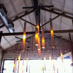 a chandelier made out of candles hanging from the ceiling