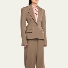 Stella McCartney sculpted blazer with dart detail Notch lapels; button front Long sleeves; button cuffs Chest welt pocket; waist flap pockets Fitted Peplum hem Wool Made in Italy Tailored Single-breasted Pantsuit With Lapel Collar, Tailored Single Breasted Pantsuit With Lapel Collar, Fall Single-breasted Pantsuit With Lapel Collar, Fall Semi-formal Pantsuit With Button Closure, Tailored Structured Blazer With Pockets, Fitted Workwear Pantsuit With Button Cuffs, Workwear Pantsuit With Lapel Collar And Button Closure, Smart Outfit, Peplum Hem