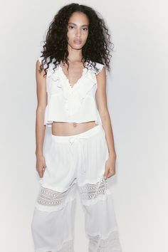 Lace-inset Crêpe Pants - Regular waist - Long - Cream - Ladies | H&M US Chic Ruffled Pants For Day Out, Chic Lace Trim Bottoms For Spring, Chic Spring Bottoms With Lace Trim, Spring Loungewear Pants With Ruffles, Casual Ruffle Bottoms In Rayon, Chic Cropped Bottoms For Daywear, Casual Rayon Bottoms With Ruffles, Cropped Summer Bottoms For Daywear, Long Pants With Lace Trim For Summer