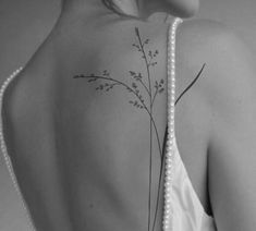 a woman with a tattoo on her back