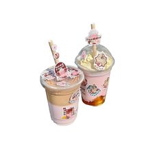 two cups filled with ice cream and toppings on top of each other in front of a white background