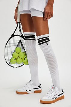 Just as versatile as they are vintage-inspired, these super cool socks are featured in a knee-high silhouette and ribbed knit fabrication with sporty stripes at top and FP Movement buti logo for an added special touch. | Knee High Logo Stripe Socks by FP Movement at Free People, White/Black