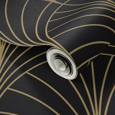 black and gold art deco wallpaper with an abstract design on the bottom half of it