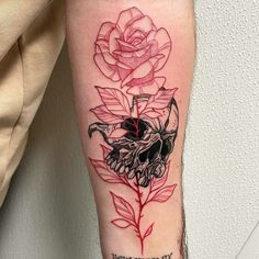 a tattoo with a rose and a skull on the arm that says, no one is dead