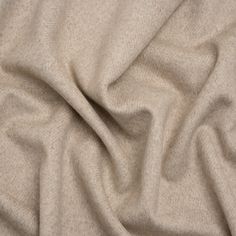 a close up view of a beige fabric