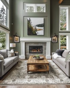 a living room with two couches and a coffee table in front of a fireplace