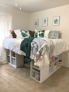 a bed with white sheets and pillows on top of it in a bedroom next to a window