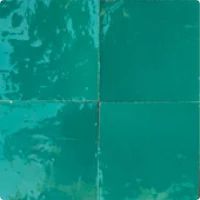 a green square shaped tile with white squares