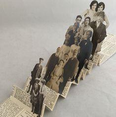 an image of people standing on top of old newspaper pages that have been cut out to look like they are going down the stairs