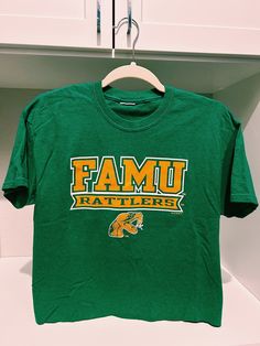 Florida A & M University crop top. It best fits a women's size medium and a size small for an oversized look. It is in great condition & is so cute on! Casual Cotton Crop Top For College, Casual Cotton Crop Top, Summer Cotton Crop Top For College, Cotton Crop Top For Summer College Days, Cotton Crop Top For College In Summer, Green Relaxed Fit Cotton Crop Top, Green Sporty Cropped Cotton T-shirt, Green Cotton Sporty Cropped T-shirt, Sporty Green Cotton Cropped T-shirt