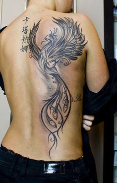 a woman with a tattoo on her back