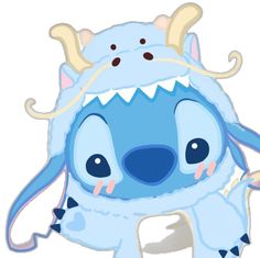 a blue stuffed animal with horns on it's head and eyes, sitting in front of a white background