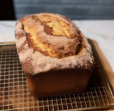 a loaf of bread sitting on top of a cooling rack