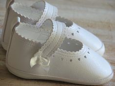 "These baby girl shoes are 100% handmade in Europe with vegan leather so they will are soft and light for your baby's tiny toes. Our baby shoes are available in the following sizes and colors; 0 - 3 months / 3.9\" 3 - 6 months / 4.3\" 6 - 9 months / 4.7\" 9 - 18 months / 5.1\" Available colors: ivory and white. All my works are very well designed and hand crafted of European quality fabrics. Made to order, ready to ship within 3-5 business days. If you have any questions, I would be happy to hel White Shoes For Girls, Christening Shoes, Handmade Baby Shoes, Shoes Handmade, Slippers For Girls, Crib Shoes, Shoes Baby, Girl Shoes