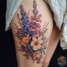 a woman's thigh with flowers on it