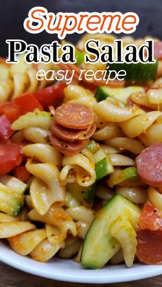 this pasta salad is loaded with sausage, tomatoes and cucumbers