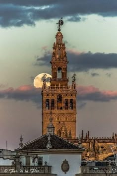 a tall tower with a clock on it's side in front of a cloudy sky