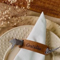 a white plate topped with a black and white checkered napkin