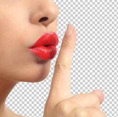 a woman's face with red lipstick on her lips, she is touching the tip of her finger