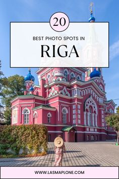 a pink building with the words best photo spots in riga on top and below it