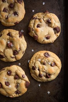 chocolate chip cookies on a baking sheet ready to be eaten