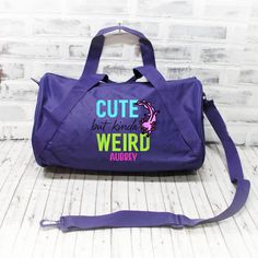 "Cute but kinda WEIRD with an axolotl and a name makes for a totally unique travel bag! Take it to use for sleepovers, weekend trips, or sporting events!   SEE PHOTOS FOR SIZE CHARTS AND POLICIES  ABOUT THIS BAG: 🐉 Choose from a large duffel - 24\", small duffel - 18\", or 12x18\" zipper top tote. 🐉 Embroidered on a denier polyester bag- Made with 50% recycled material. Small bag has a single zippered main compartment, with a diagonal webbing handle and detachable adjustable barrel shoulder st Fun Purple Backpack, Fun School Pouch Bag, Cheerleading Bags, On The Go Bag, Black Duffle Bag, Cheer Bag, Dance Gear, Small Luggage, Go Bag