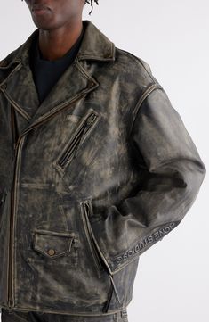 An oversized biker jacket is crafted from artfully marked-up leather and features tasseled zip pulls and a plush quilted-satin lining for unexpected contrast. 30" length (size 48EU) Asymmetric zip closure Notched lapels Zip cuffs Chest zip pocket; front zip pockets; front snap-flap pocket Lined, with 100% polyester fill Leather Professional leather clean Imported Designer Clothing Leather Clothes Men, Distressed Biker Outerwear For Streetwear, Leather Streetwear Outerwear With Pockets, Worn Leather Jacket, Black Distressed Biker Outerwear, Acne Studios Leather Jacket, Acne Studio Leather Jacket, Acne Studios Menswear, Oversized Biker Jacket