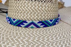 "5/8\" wide All bead work is beaded with 10lb extreme braided nylon line. All hat bands are finished at 23\" with glued than sewed down leather ends and an adjustable leather tie." Southwestern Blue Beaded Hat Band, Handmade Southwestern Blue Hat Band, Blue Beaded Hat Bands For Festival, Adjustable Beaded Blue Hat, Blue Adjustable Custom Hat Bands, Adjustable Western Purple Hat, Adjustable Blue Beaded Hat, Adjustable Handmade Purple Hats, Adjustable Blue Southwestern Hat Band