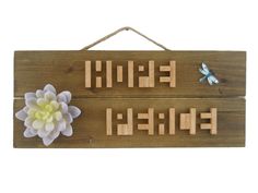 two wooden signs with flowers on them and the words hello, friend written in large letters