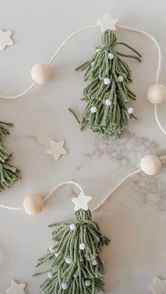 christmas decorations are hanging on a marble surface