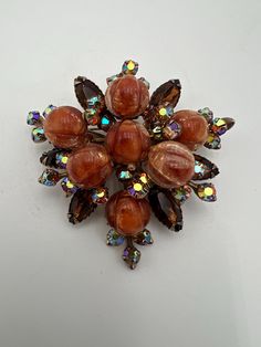 Vintage aurora borealis and topaz rhinestone brooch with art glass style lucite beads in style of beau jewels or Judy Lee  In excellent condition  Measures 2.5" 2024 Orange Brooch Jewelry For Party, Glass Style, Rhinestone Brooches, Aurora Borealis, Art Glass, Brooch Pin, In Style, Brooches, Aurora